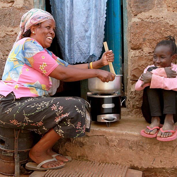 Woman cooking with a cookstove
